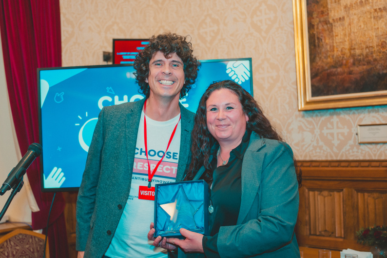 Ms Hurt receiving the award from ABA Patron, Andy Day