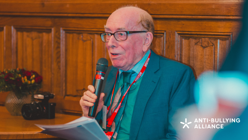 Picture of Professor Peter Smith speaking into a mic