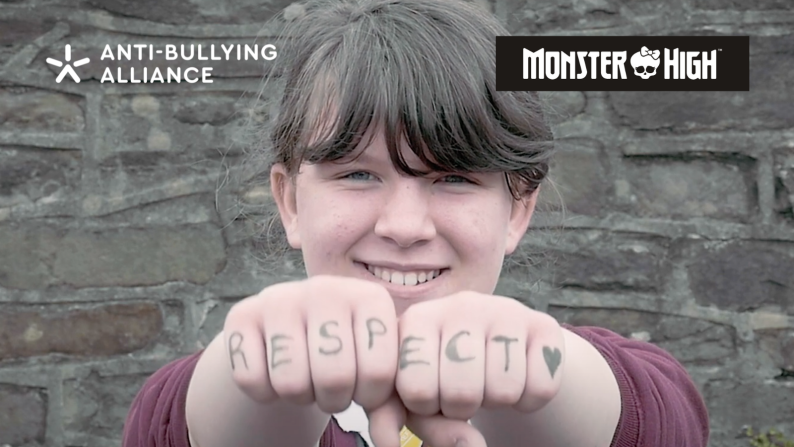 'Respect' written on a young persons hands