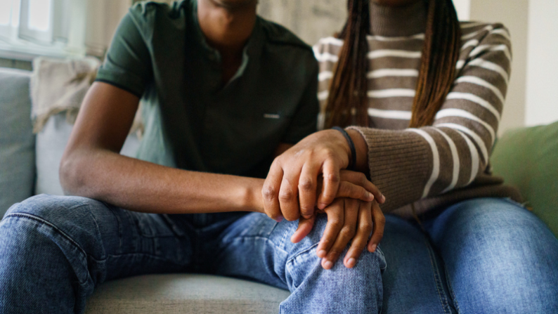 two people holding hands