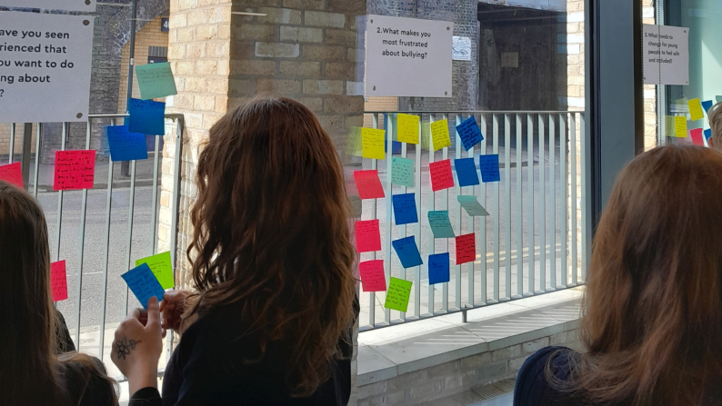 Young ABA participating in the Wall of Change Activity