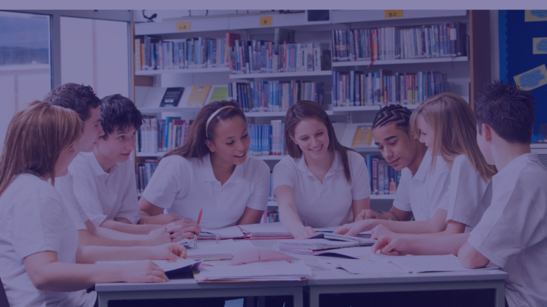 Secondary school pupils around table 