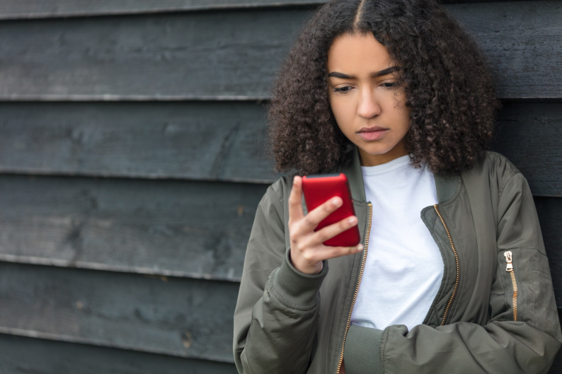 Girl looking at her smart phone